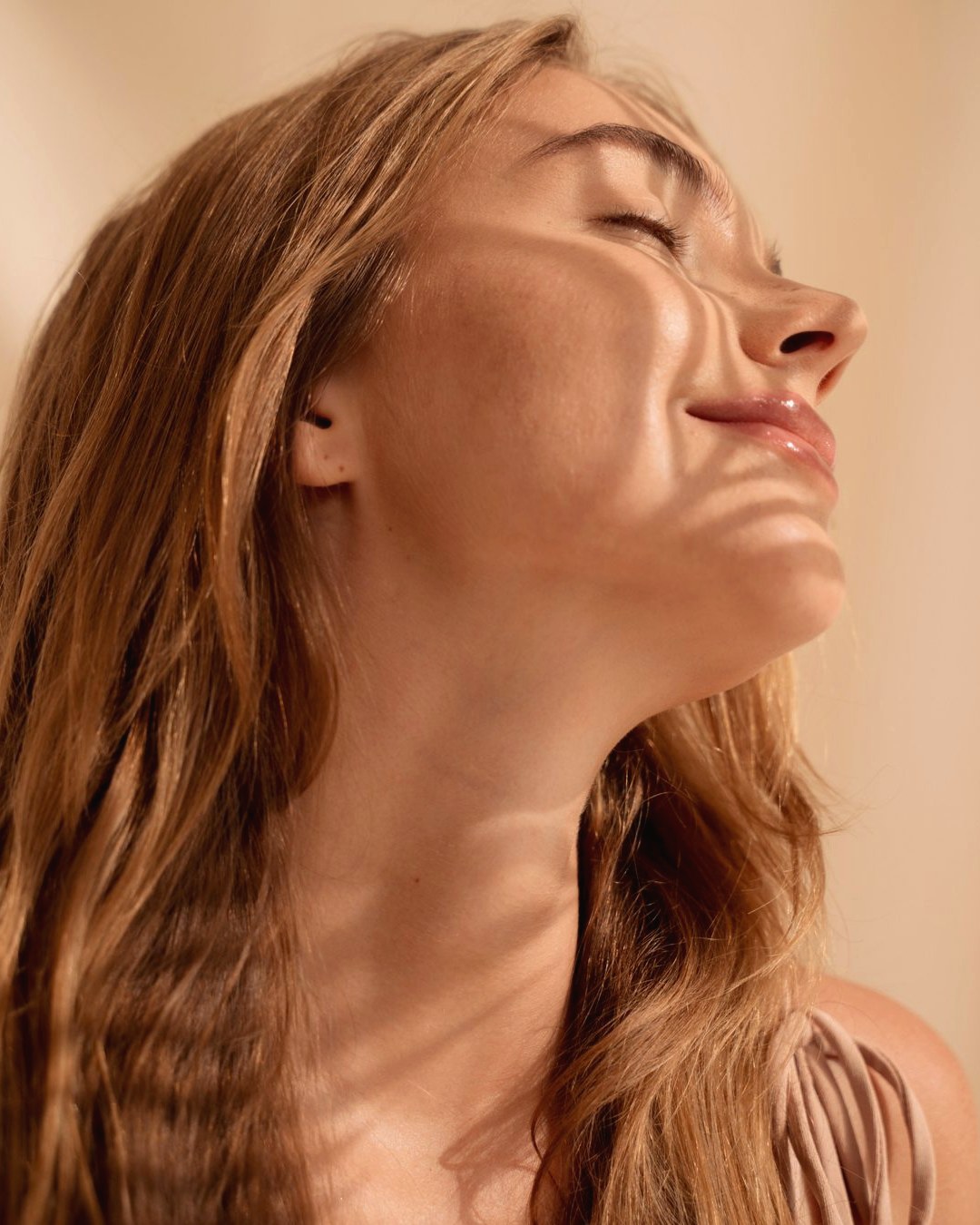 Woman with luminous skin in warm light